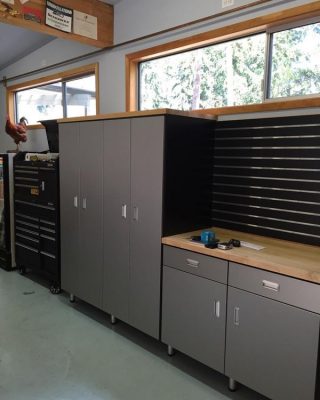 Built-in garage cabinets and tool storage, showcasing wall-mounted garage organization for functional and clutter-free spaces.