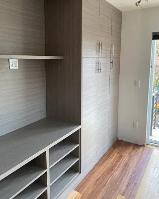 Contemporary mudroom with tall custom cabinets, cubbies, and bench seating, showcasing built-in mudroom organization solutions.